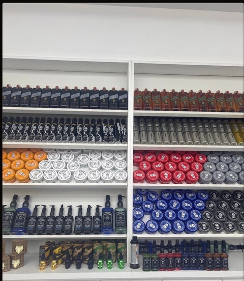 Shelving unit displaying organized bottles and jars or various beauty and personal care products in different colors and sizes